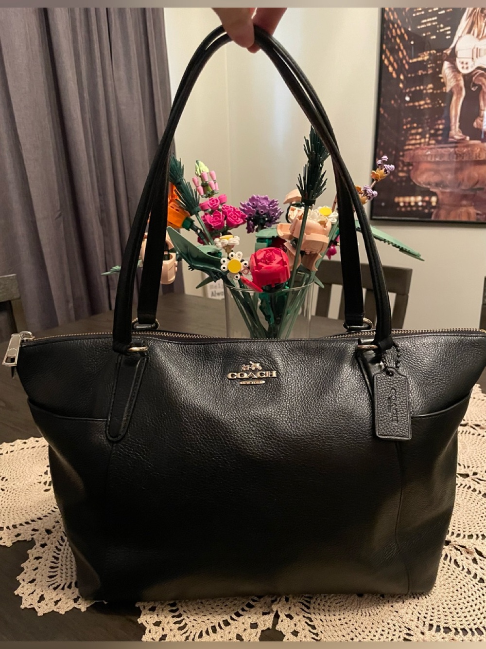 Coach Ava II tote features gold-toned hardware side pockets blackpebbled leather